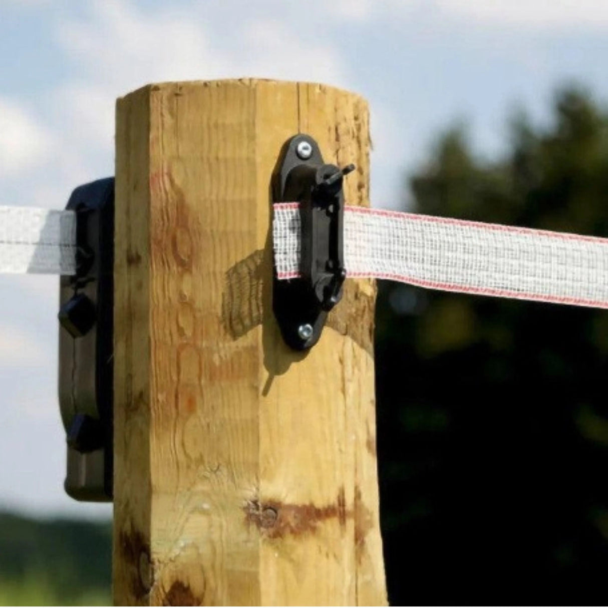 Corral Electric Fence Insulators Corner and Distance Post mounted on a wooden post for electric fencing