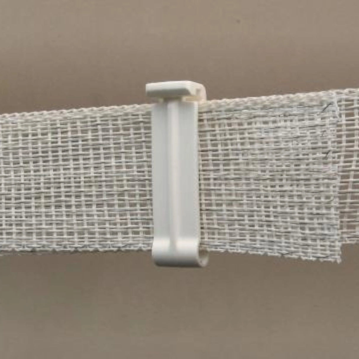 Close-up view of Dare Equine Fencing Tape Clip for 1 1/2-inch tape securing tapes