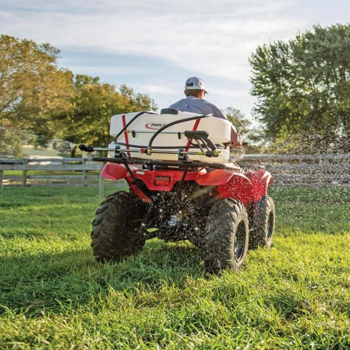 A man using ATV Sprayer 25 Gallon 3 Nozzle Boomless Broadcast in the outdoors, Kamloops, British Columbia