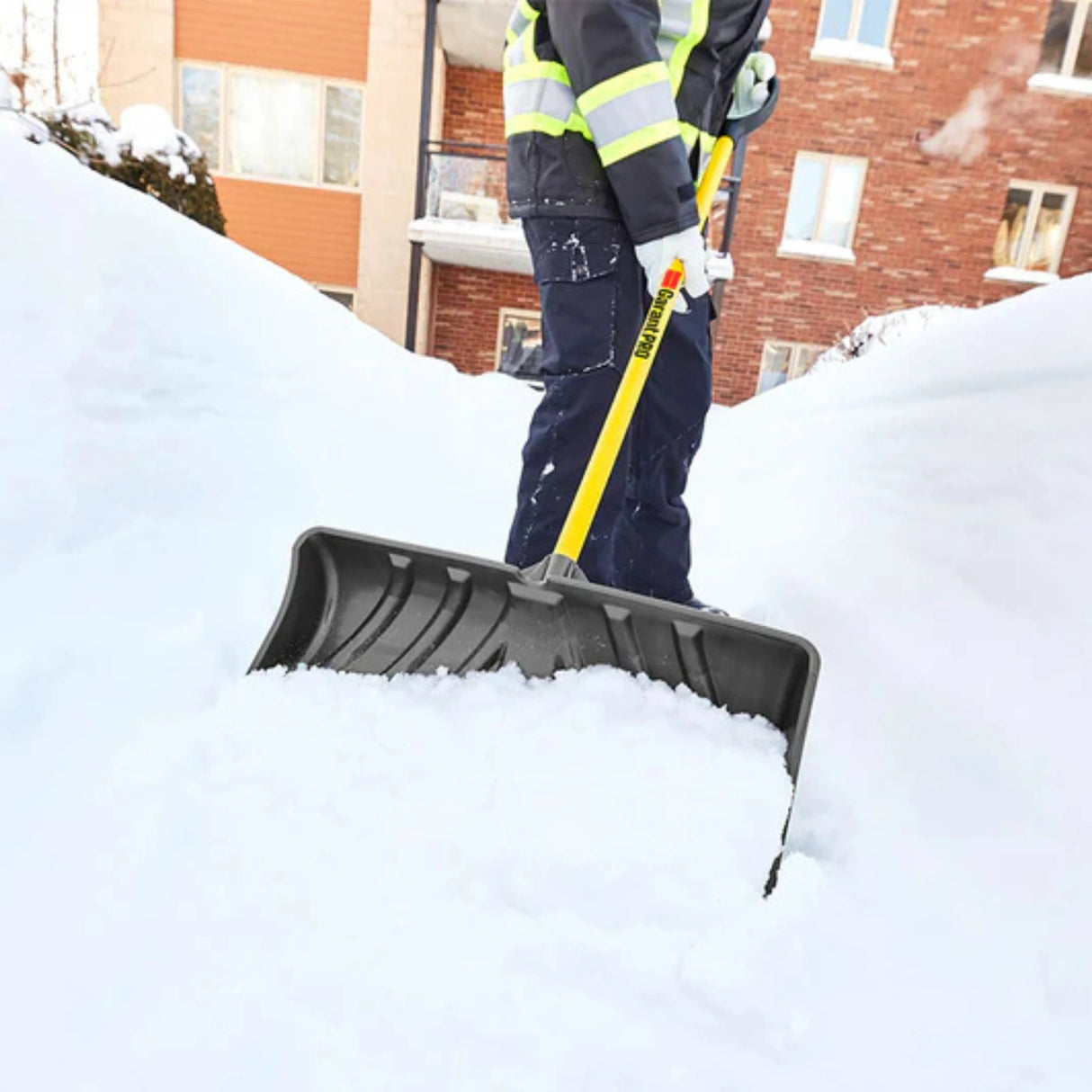 Garant poly fiberglass snow pusher clearing snow outdoors in Kamloops, British Columbia
