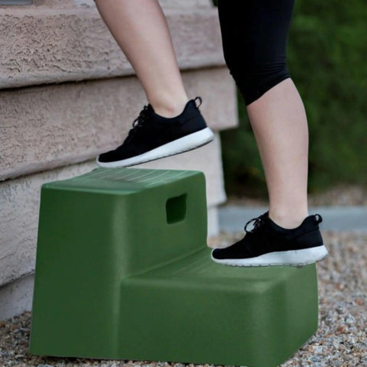 A Horsemen's Pride Mounting Block Two-Step being used
