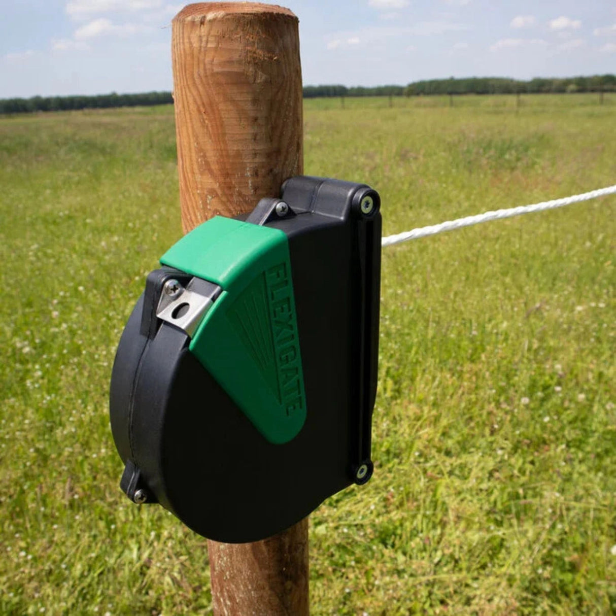 Corral 7.5 Meter Flexible Gate System Automatic Reel installed on a pasture fence