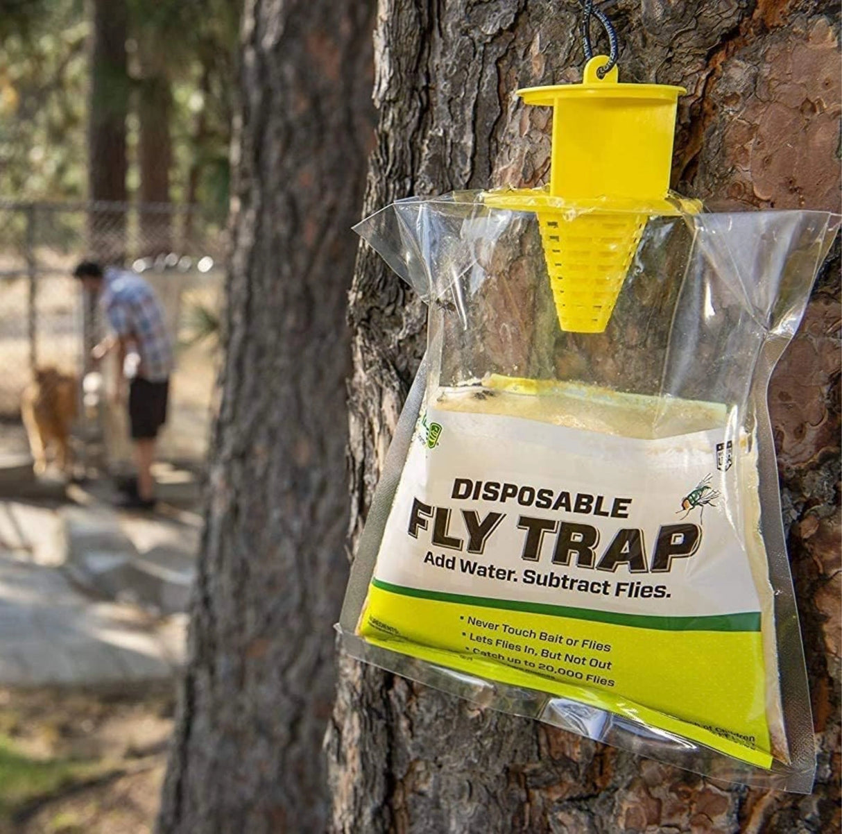 Rescue Disposable Fly Trap Bag with Attachment hanging on a tree in the outdoors of Kamloops, British Columbia
