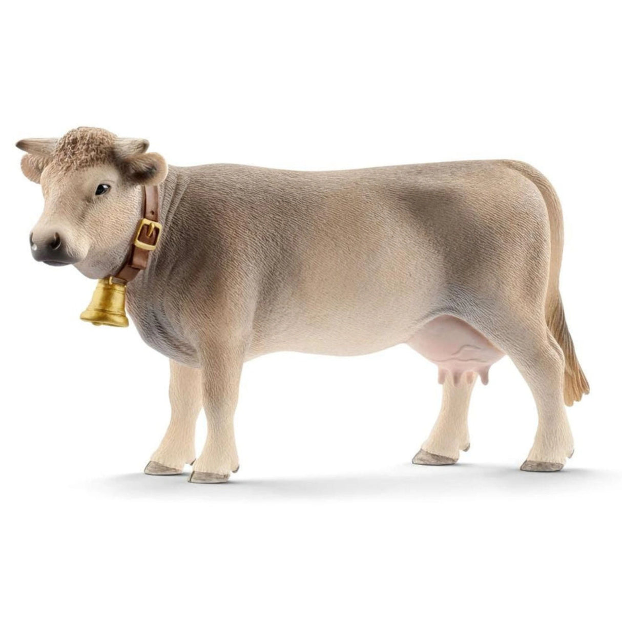 A close-up view of Schleich Braunvieh Cow farm animal toy on a white background
