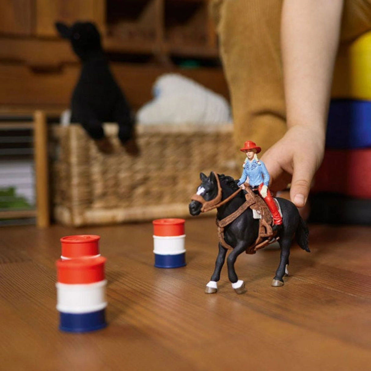 Child playing with Schleich Farm World horse toy in a bright playroom