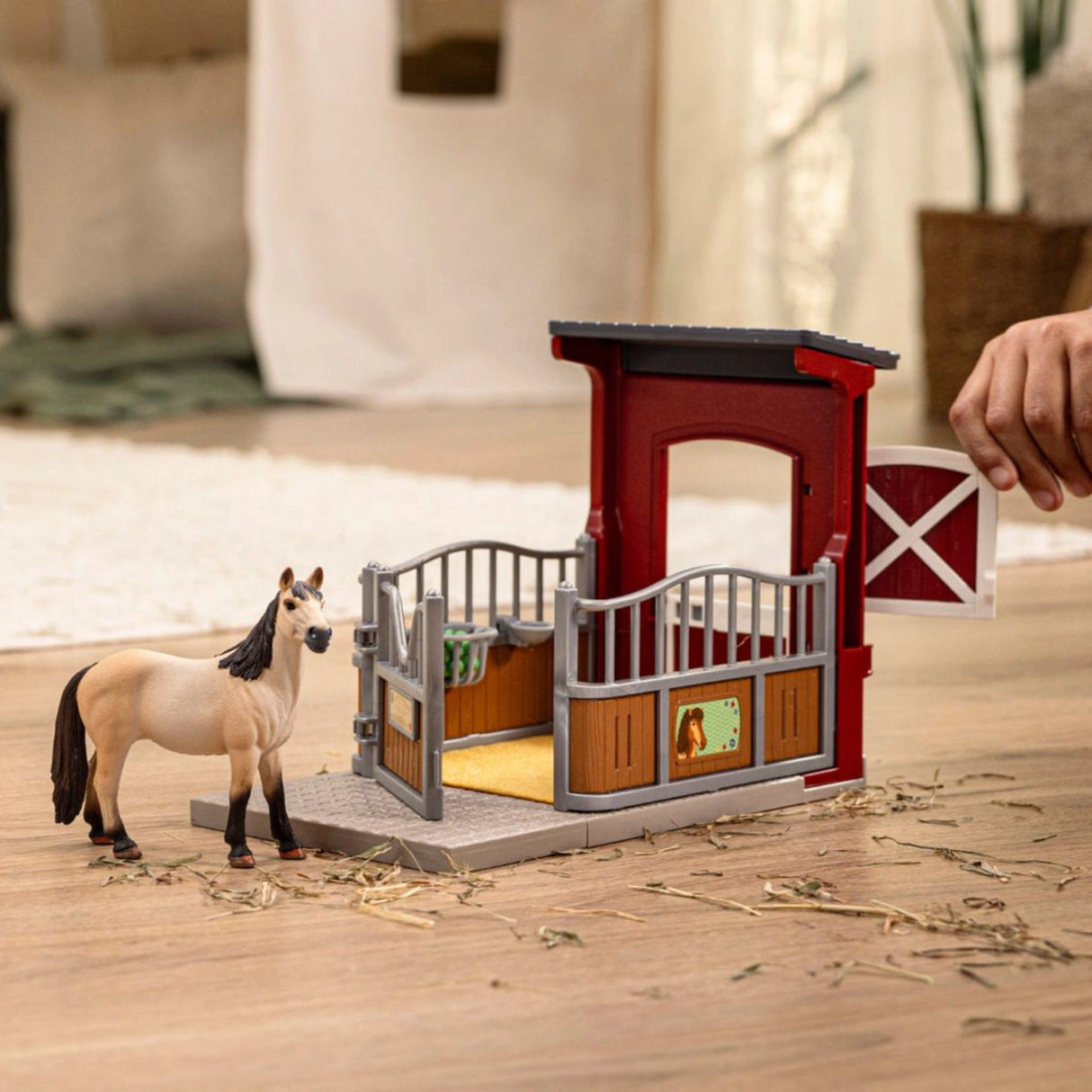 Young child playing with Schleich Horse Toy Ponybox with Mustang Mare