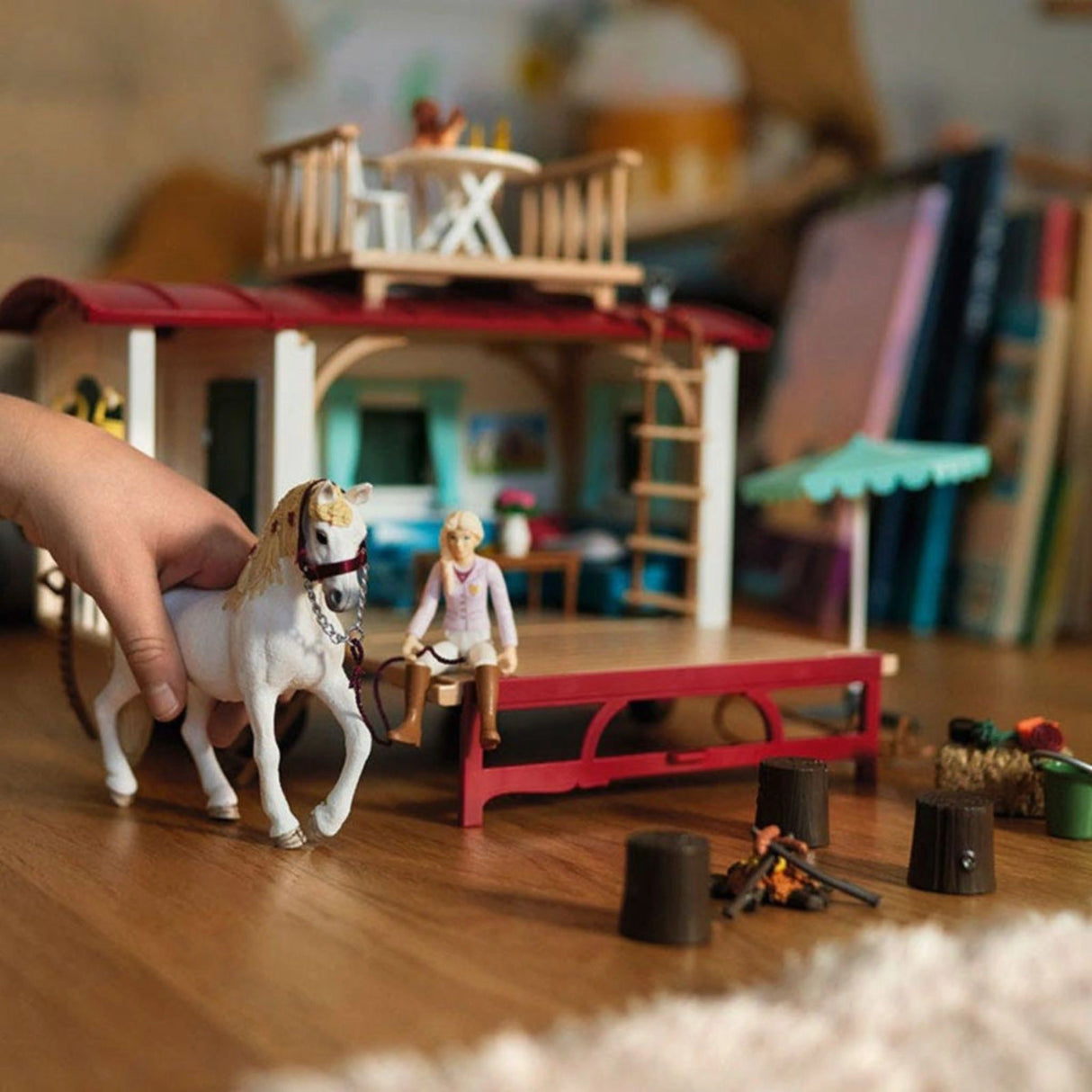 Child playing with Schleich Horse Club Caravan for Secret Club Meetings in a bright playroom