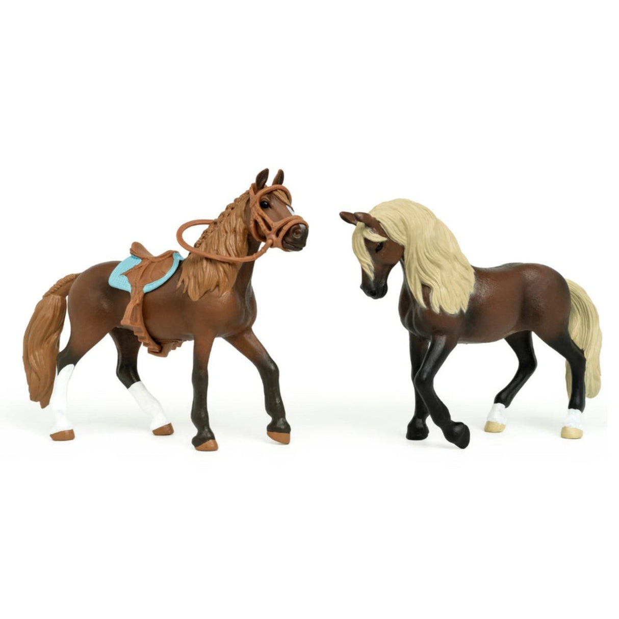 A close-up view of Schleich horse toy starter set featuring Paso Peruano mare and stallion on a white background