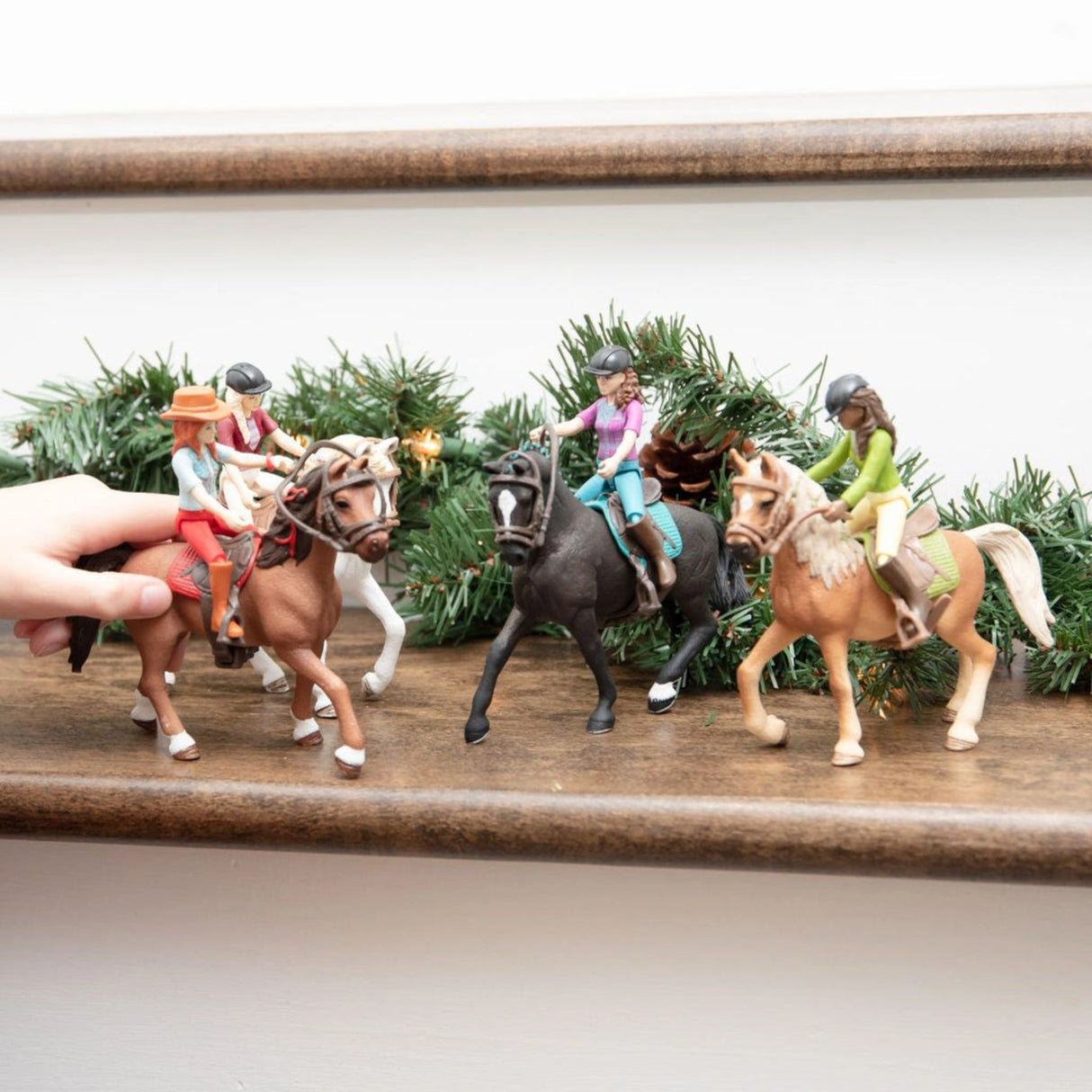 A child using the Schleich Horse Toy playset to create stories in a cozy indoor playroom