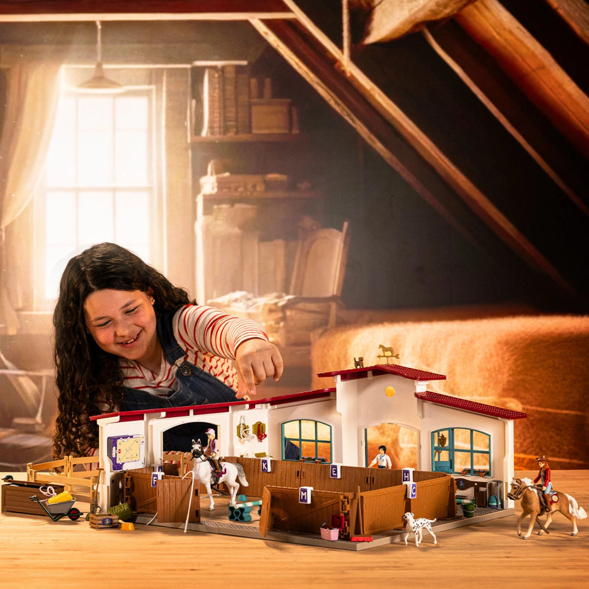 A child playing with Schleich Horse Club Riding Arena Peppertree horse toy in a playroom