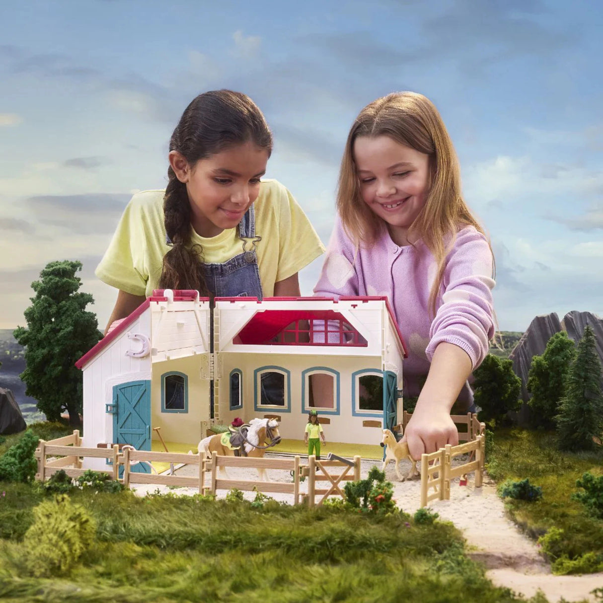 Children playing with the Schleich Horse Club Open Stable Little Horseshoe Horse Toy