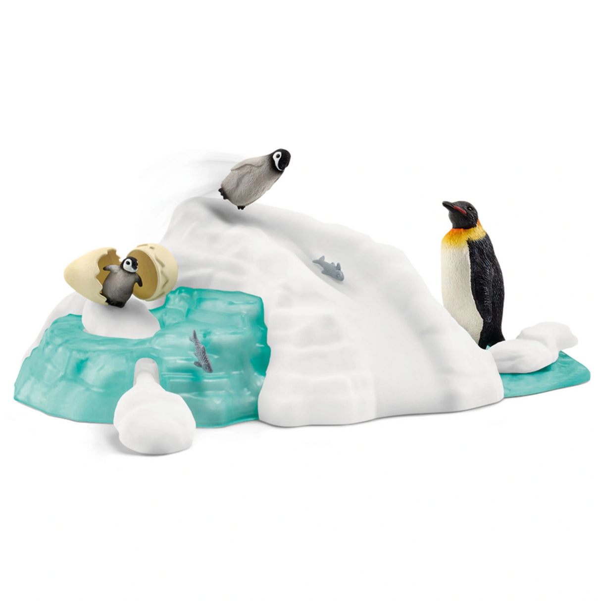 A close-up view of Schleich Wild Animal Toys Penguin Family Fun playset on a white background