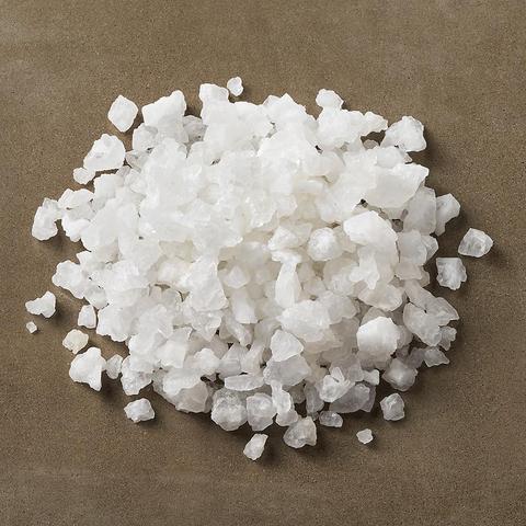a pile of water softener salt on a stone surface