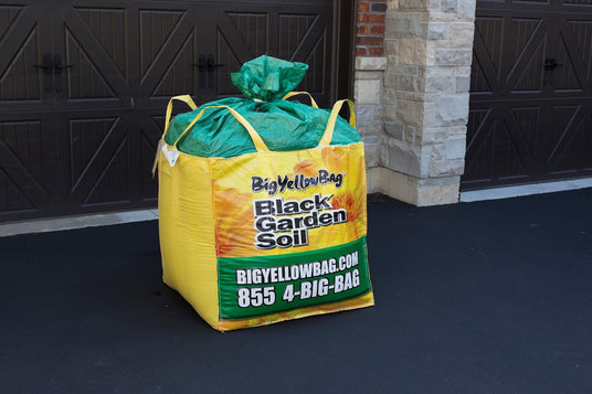 Big Yellow Bag large tarpaulin bag with the words "Black Garden Soil" printed on the front