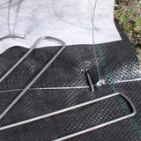 American Netting Metal Fabric Staples in use on landscape fabric outdoors in Kamloops, British Columbia