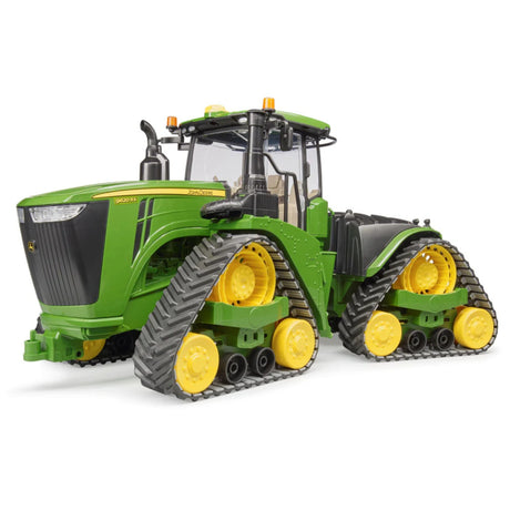 A close-up view of Bruder John Deere Toy 9620RX Crawler Track Tractor on a white background