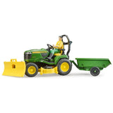 A close-up view of Bruder John Deere Toy on a white background