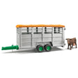 A close-up view of Bruder Livestock Trailer Farm Toy with cow on a white background