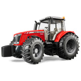 A close-up view of Bruder Massey Ferguson tractor toy on a white background