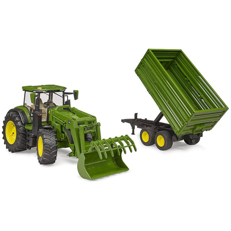 Close-up view of Bruder 7R Tractor with Front Loader and Trailer John Deere Toy on a white background