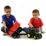 Children playing with Bruder Tractor with Tipping Trailer John Deere Toy