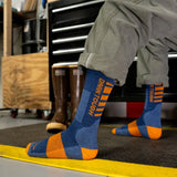 Darn Tough Men's Backbone Boot Midweight Work Sock is being worn indoors