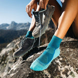 Darn Tough Women's Light Hiker Quarter Lightweight Hiking Socks worn outdoors on hiking trails in Kamloops, British Columbia