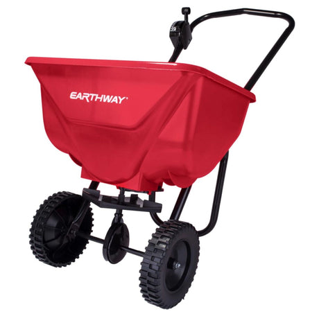 Close-up view of EarthWay broadcast fertilizer spreader on a white background