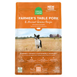 Front view of Open Farm Pork Dog Food with ancient grains on a white background