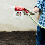 A gardener using the Ortho Dial ‘N Spray Hose End Sprayer in the outdoors in Kamloops, British Colombia