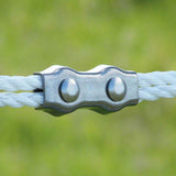 Patriot rope clamps securing a polirope fence line on rural farmland in Kamloops, British Columbia