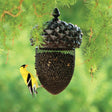 Purity Feed acorn shape bird feeder hung outdoors in Kamloops, British Columbia attracting wild birds