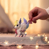Schleich Bayala Rainbow Baby Dragon being played with by a child inside a playroom