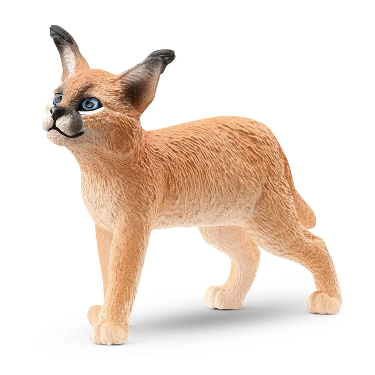 A close-up view of Schleich Caracal Baby Wild Animal Toy on a white background