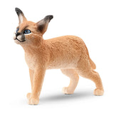 A close-up view of Schleich Caracal Baby Wild Animal Toy on a white background