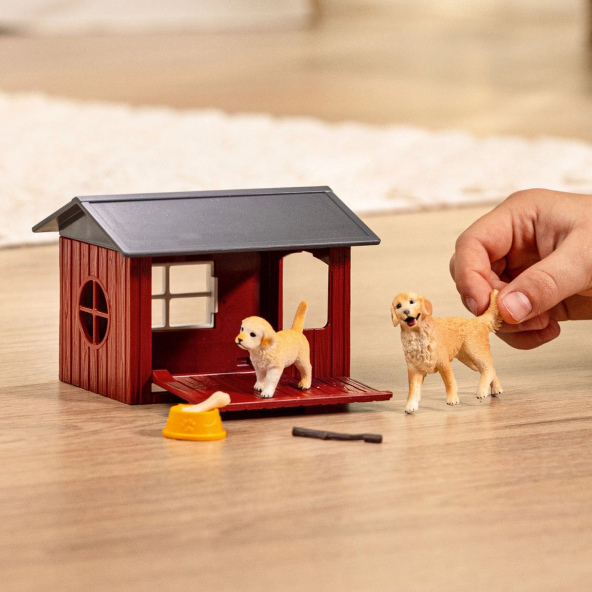 Child playing with Schleich Dog Kennel with Golden Retriever Farm Animal Toys in a playroom