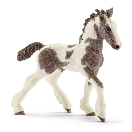 A close-up view of Schleich Farm Animal Toy Tinker Foal on a white background