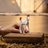 A child enjoying pretend play with the Schleich Horse Club Marwari Foal figure in a cozy playroom