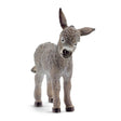 Close-up of Schleich Light Grey Donkey Foal farm animal toy showing realistic features on white background
