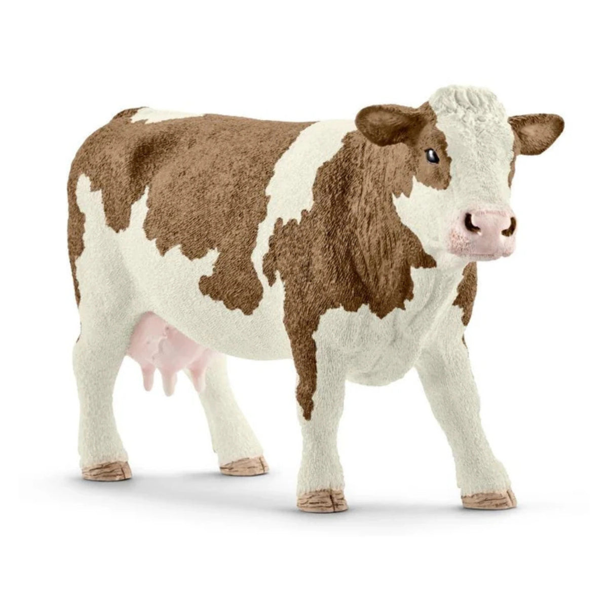 Close-up side view of Schleich Simmental Cow Farm Animal Toys detailed head and body on a white background