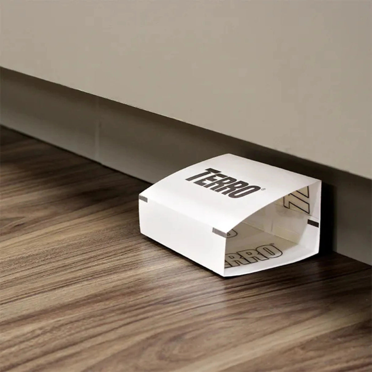 Terro Spider and Insect Trap being used indoors along baseboards